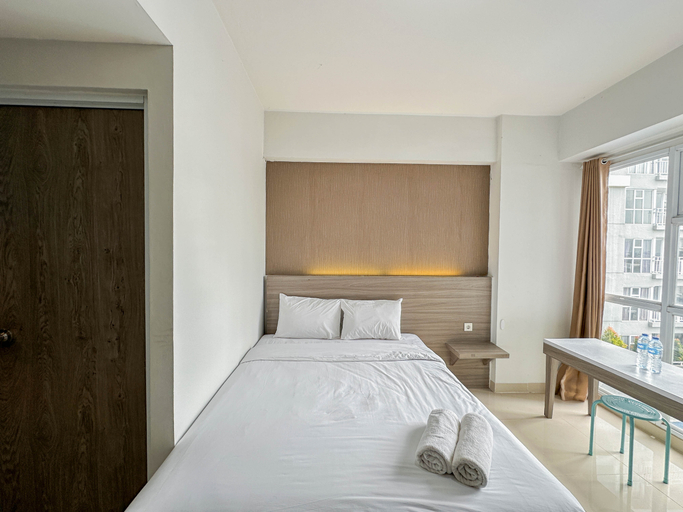 Tiny Studio with Pool View at Taman Melati Surabaya Apartment By Travelio, Surabaya