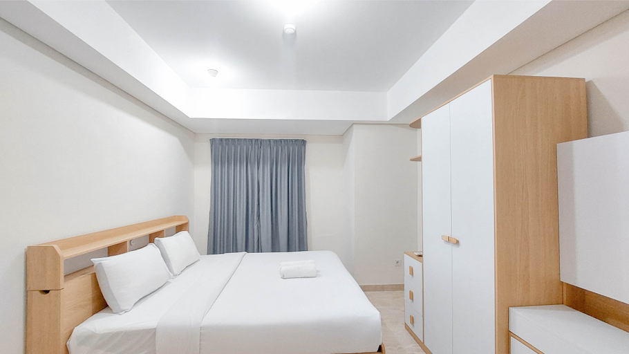 Bedroom 2, Spacious and Homey 2BR at Podomoro City Deli Medan Apartment By Travelio, Medan