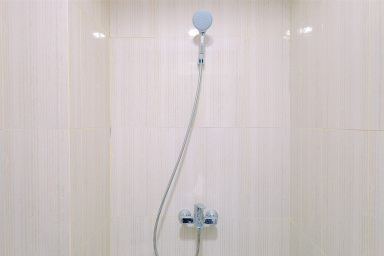 Bathroom 5, Restful and Modern 2BR at Sentul Tower Apartment By Travelio, Bogor