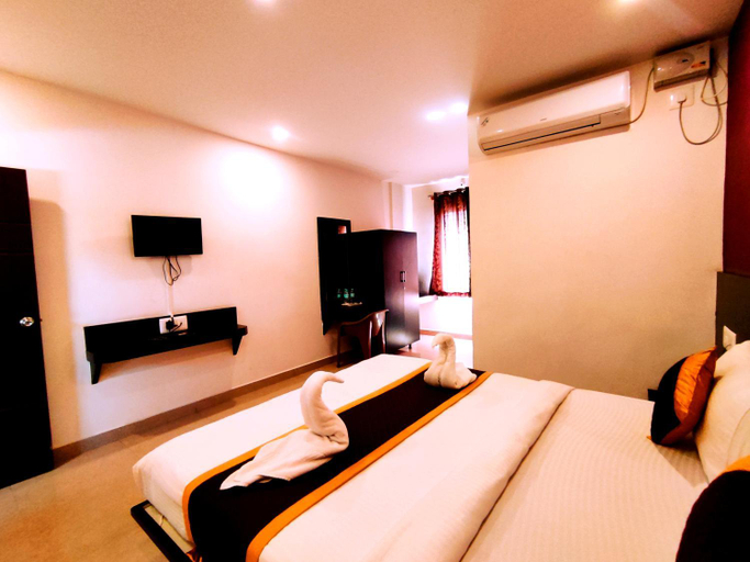 Bedroom, Yuvraj Galaxy Inn, Mysore