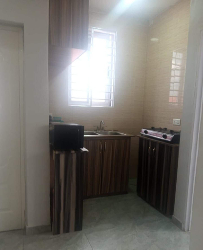 Private kitchen, Impeccable Comfortable One Bed Apartment in Accra, Tema