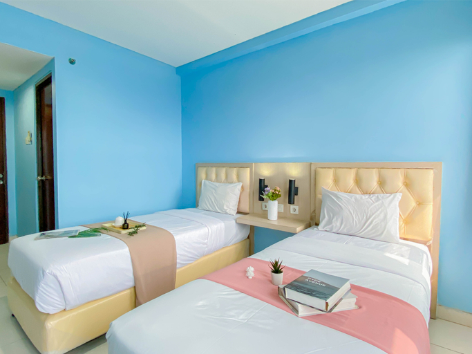Bedroom 3, Simple Blue Toned Studio (No Kitchen) at Elvis Tower Apartment By Travelio, Cikarang
