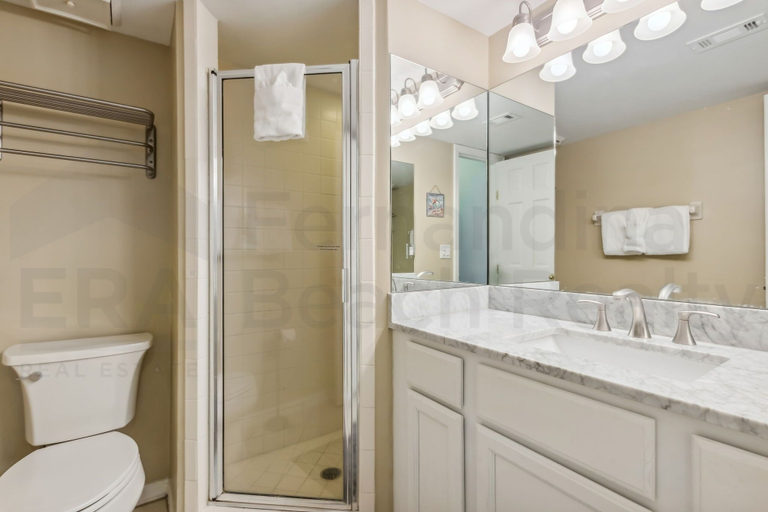 Bathroom 2, Coast View Condo Featuring Large Windows Overlooking the Beach by RedAwning, Nassau