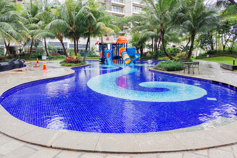 Swimming Pool 3, Nice Designed and Comfortable 3BR Apartment Sky House BSD By Travelio, Tangerang Selatan