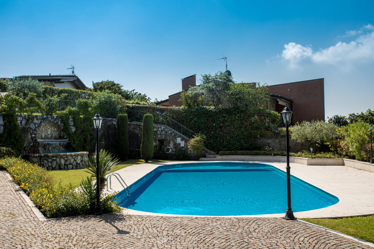 Swimming pool 4, Red villa with shared pool and private garden is the new black on Lake Garda, Brescia