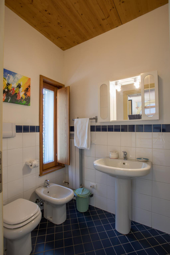 Bathroom, Red villa with shared pool and private garden is the new black on Lake Garda, Brescia