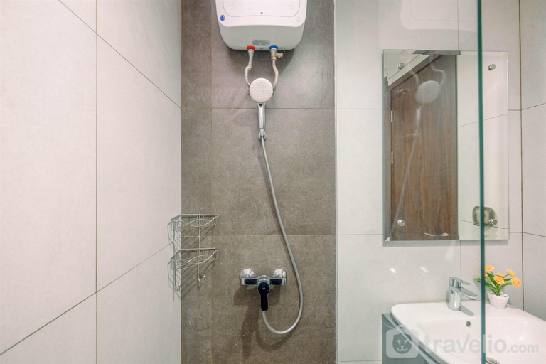 Bathroom 5, Modern Studio at LRT City Bekasi Apartment By Travelio, Bekasi