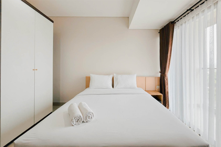 Bedroom 5, Modern Look Studio Apartment at Patraland Amarta By Travelio, Sleman