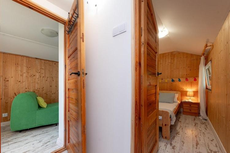 Bedroom 2, Scandinavian holiday home right by the lake, Łobez