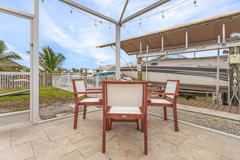 Outdoor dining 4, 467 Water Front W/ Pool & Canal Access 3 Bedroom Home, Lee