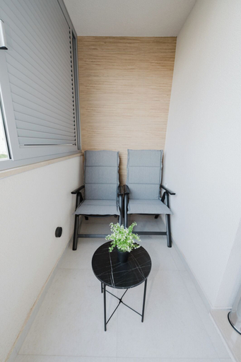 Balcony 3, Koi Deluxe, Urban Two Bedroom Oasis, Split