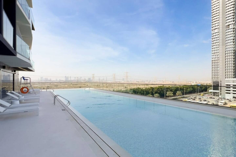 Outdoor pool 3, Elegant 1BR Stay in Binghatti Heights, Dubai