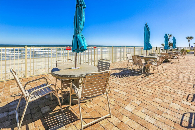 Outdoor dining 4, Beachfront Gem: Serene 2BD Haven With Pool & Views, Saint Johns