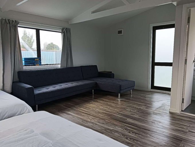 Living area 2, 4 Double Beds and 2 Sofa Bed chalet, Rotorua