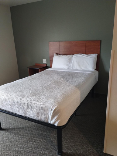 Bed, Suburban Studios Extended Stay Hotel, McKenzie