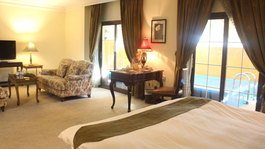 Bedroom 4, The Convention Center & Royal Suites Hotel