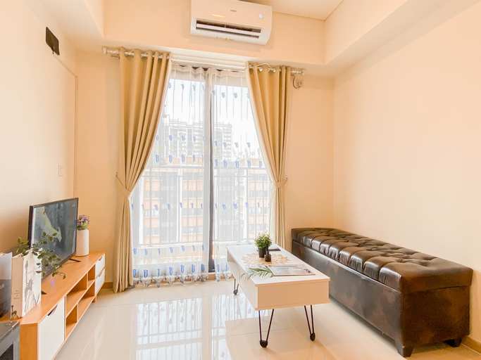 Living Room 3, Cozy and Trendy 2BR Apartment Meikarta By Travelio, Cikarang