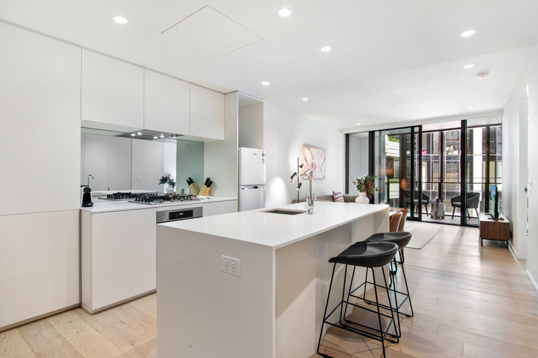 Private kitchen 3, Spacious Modern Apartment With Pool & Gym Access, Melbourne