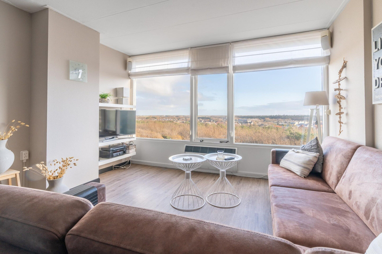 Living room 3, 4-person apartment with island view, Texel