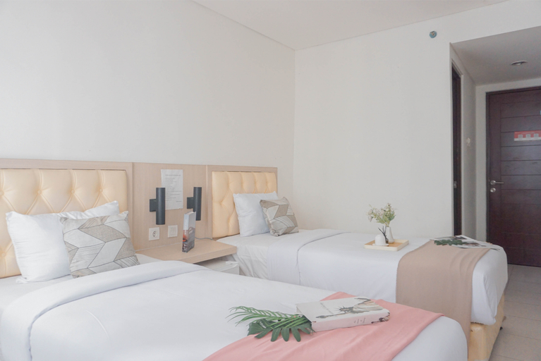 Bedroom 5, Good Studio (No Kitchen) at Elvis Tower Apartment By Travelio, Cikarang