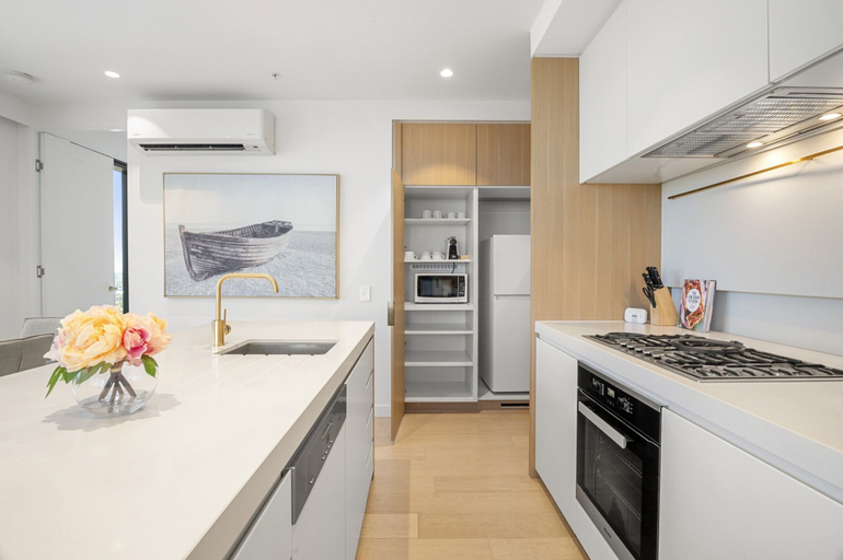 Private kitchen, High-rise 3-bed Apartment With Premium Amenities, Melbourne