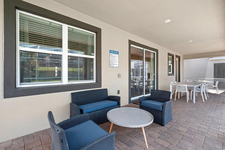Outdoor dining, ChampionsGate 9 Bedroom Pool Home with Game Room 9 Home, Osceola