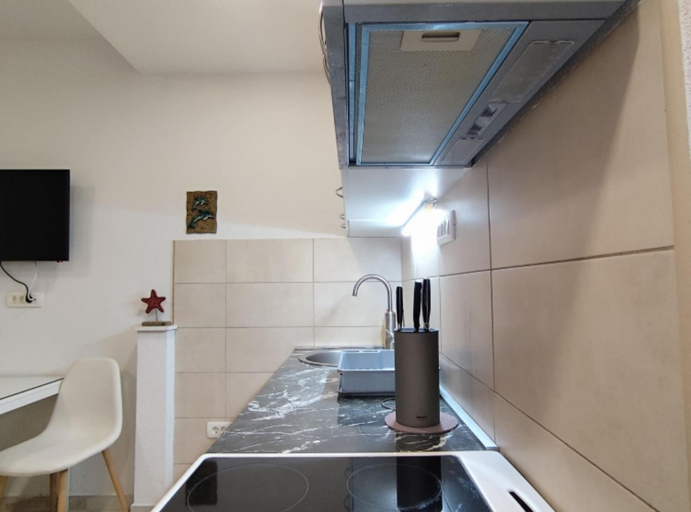 Private kitchen 4, Comfort Apartments Igalo 60 m From the Sea
