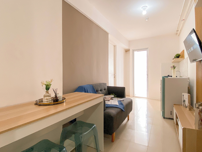 Living area 2, Comfy Warm Tone 1Br At Apartment Bassura City, Jakarta Timur
