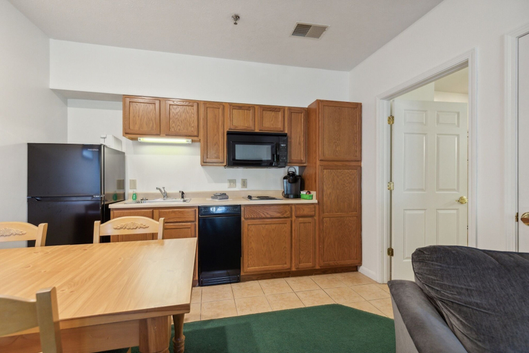 Private kitchen, 1st Floor Front Side Suite - 104 by Grand Wood Suites, Brown