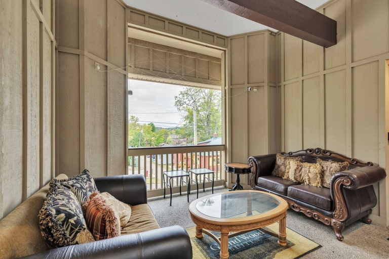 Living area 3, 3rd Floor Front Side Corner Penthouse Suite - 301 by Grand Wood Suites, Brown