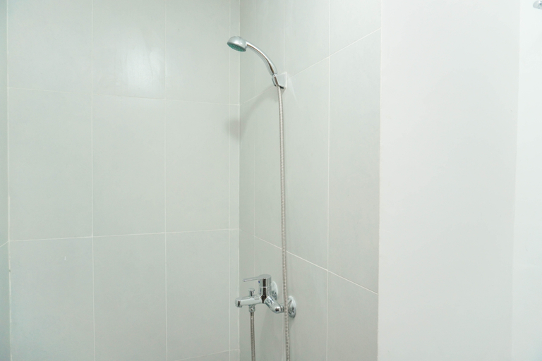 Bathroom 2, Tranquil 1BR at Royal Sentul Park Apartment By Travelio, Bogor