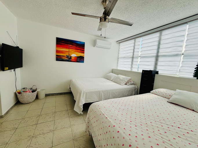 Bedroom 2, Beachfront Tropical Tantra Apartment