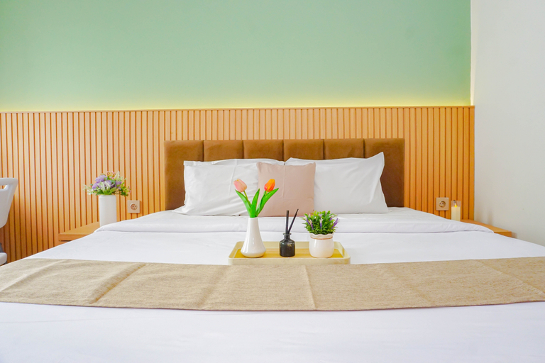 Bedroom 2, Soft Toned Studio at Transpark Cibubur Apartment By Travelio, Depok