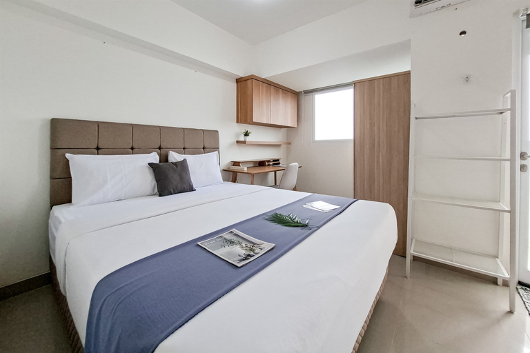 Bedroom 5, Compact White Studio at Cisauk Point Apartment By Travelio, Tangerang