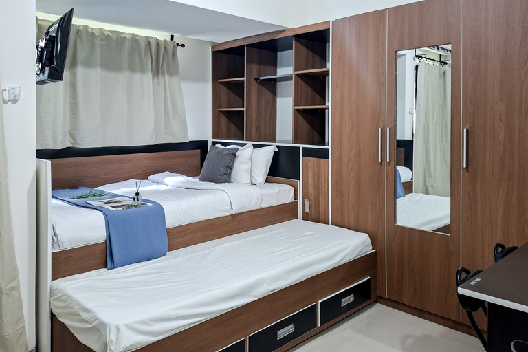 Bedroom 3, Comfortable and Warm Studio Room at Cisauk Point Apartment by Travelio, Tangerang