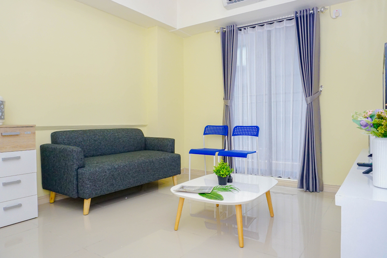 Living Room 5, Modern Space and Restful 2BR at Apartment Meikarta By Travelio, Cikarang