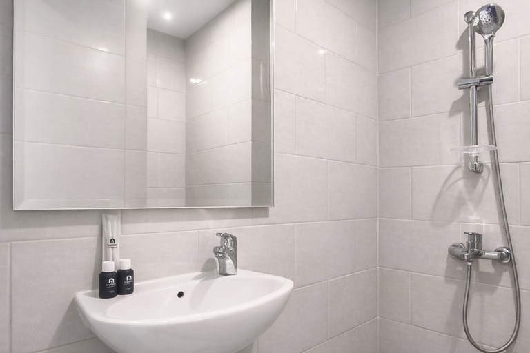 Bathroom 2, Magnificent Studio with Mall Access at Benson Supermall Mansion Apartment By Travelio, Surabaya