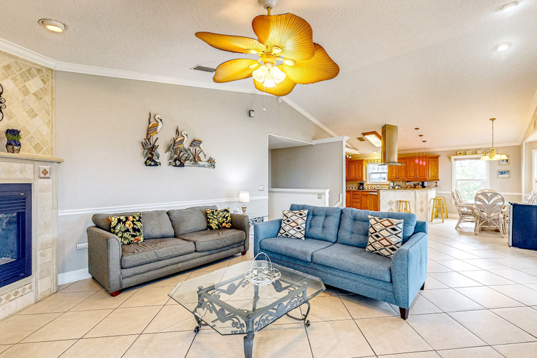 Living area 5, Tropical Gem w/ Courtyard & Large Deck Stroll 1 Block to Beach Boardwalk, Saint Johns