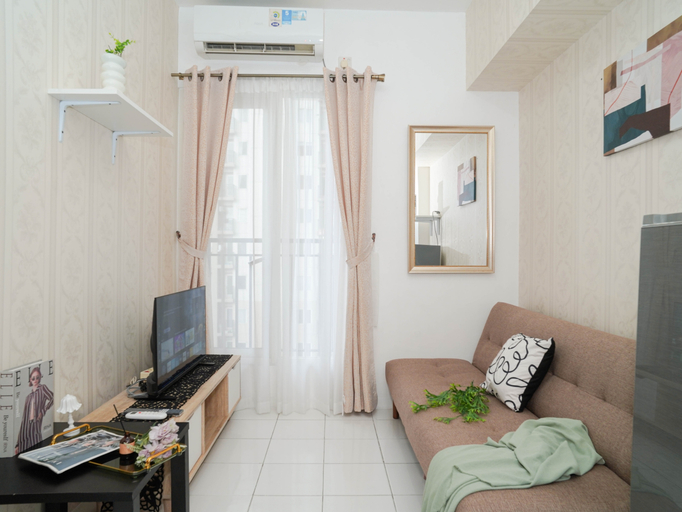 Living Room 2, Nice Look 2BR at Podomoro Golf View Apartment By Travelio, Bogor