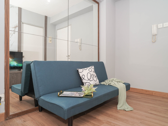Living Room 5, Homey and Restful 2BR at Apartment Green Bay Pluit By Travelio, Jakarta Utara
