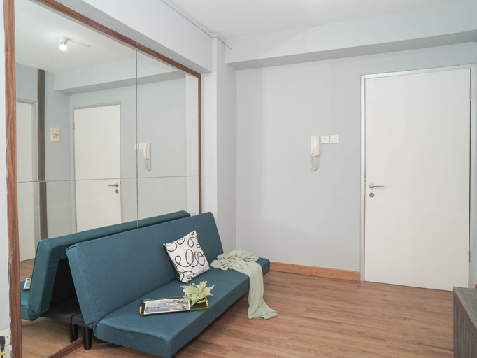 Living Room 3, Homey and Restful 2BR at Apartment Green Bay Pluit By Travelio, Jakarta Utara