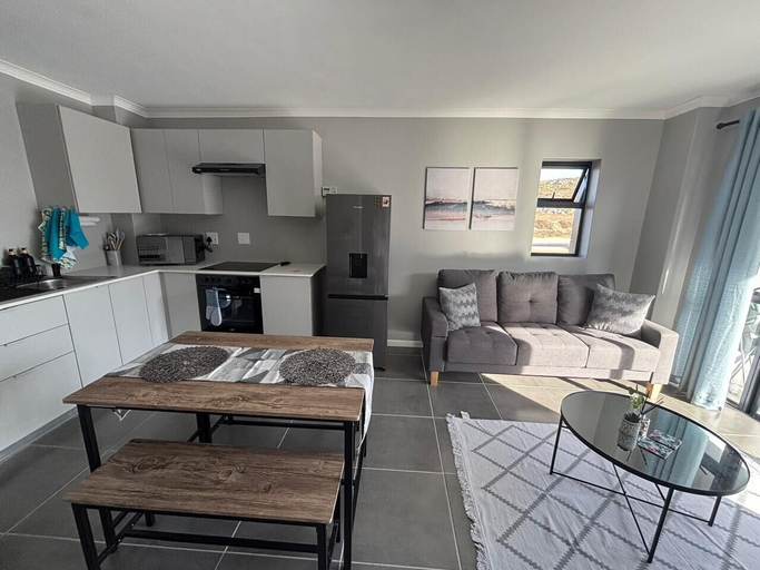 Living area 2, Holiday Apartments - Millennial Arch, West Coast