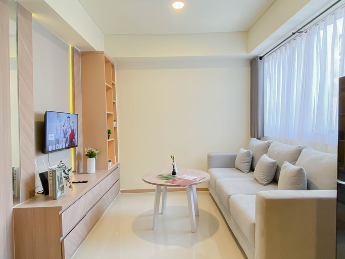 Living Room 5, Comfortable and Good 2BR Space at Apartment Meikarta By Travelio, Cikarang