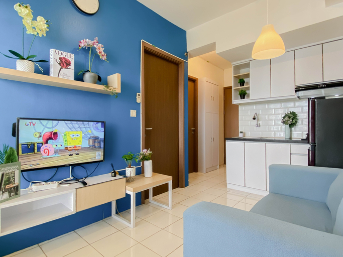 Living Room 3, Cozy with Blue Accent 2BR at Podomoro Golf View Apartment By Travelio, Bogor