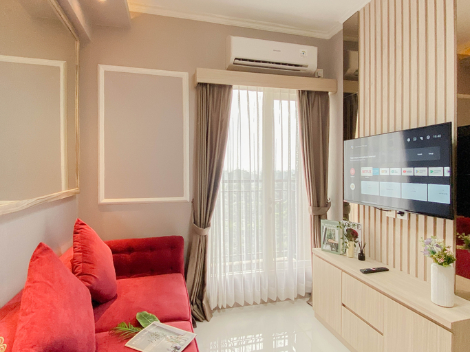 Living Room 2, 2BR Corner with South and East View at Podomoro Golf View Apartment By Travelio, Bogor