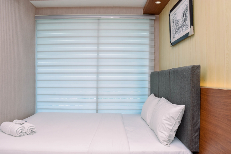 Bedroom 2, Spacious and Cozy 2BR Grand Kamala Lagoon Apartment By Travelio, Bekasi