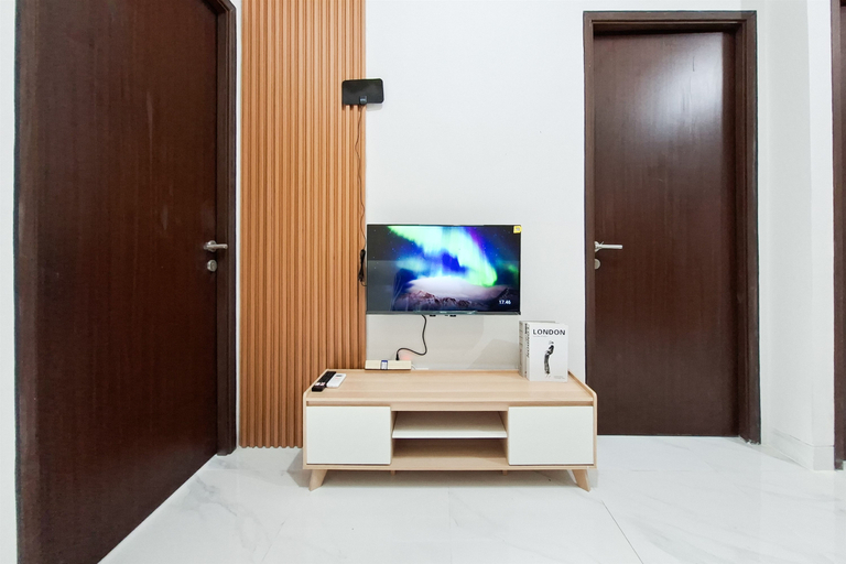 Living Room 5, Convenient and Roomy 2BR at Apartment Transpark Bintaro By Travelio, South Tangerang