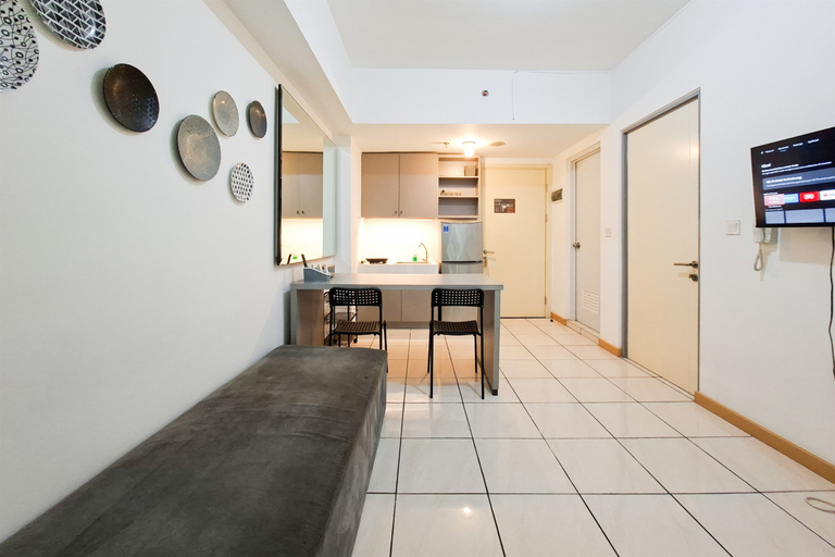 Living Room 5, Simple 2BR Space at Apartment M-Town Residence By Travelio, Tangerang