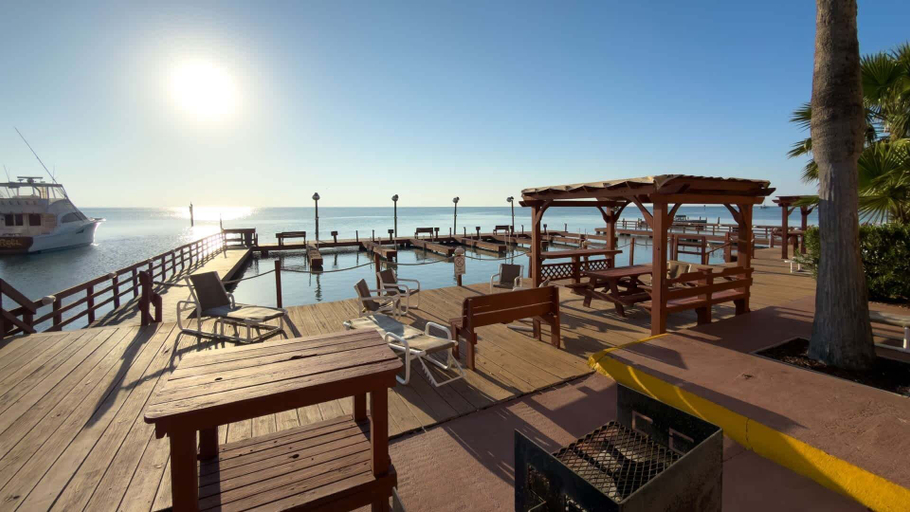 Outdoor dining 4, Direct Bayfront Sunsets - Boat Docks - Pool - Fish 2 Bedroom Apts, Cameron
