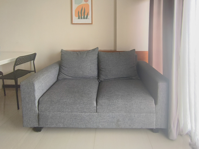 Living Room 4, Neat and Restful 2BR at Gateway Pasteur Apartment By Travelio, Bandung
